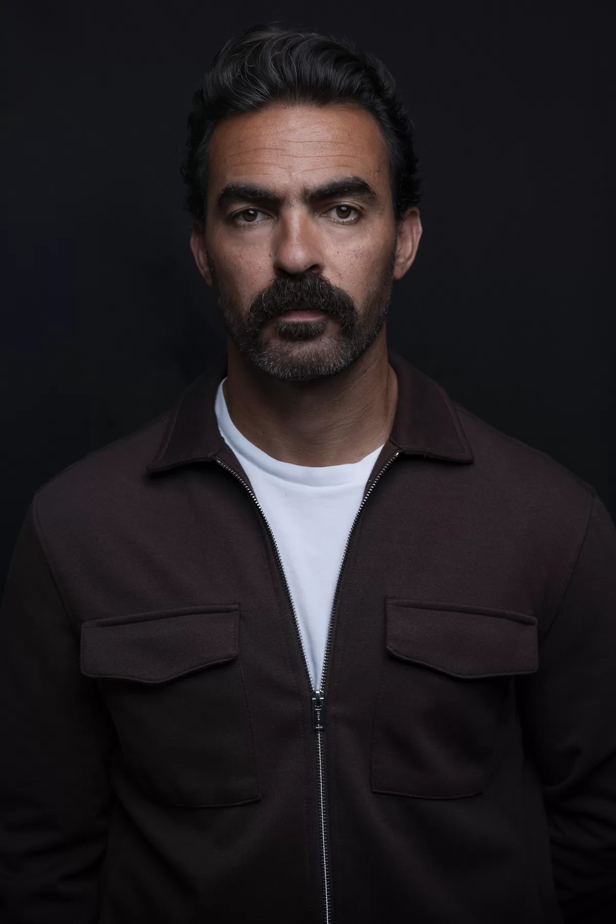 Dramatic studio actor headshot of Ali