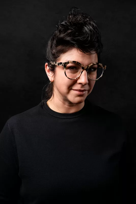 Promosa team member with glasses